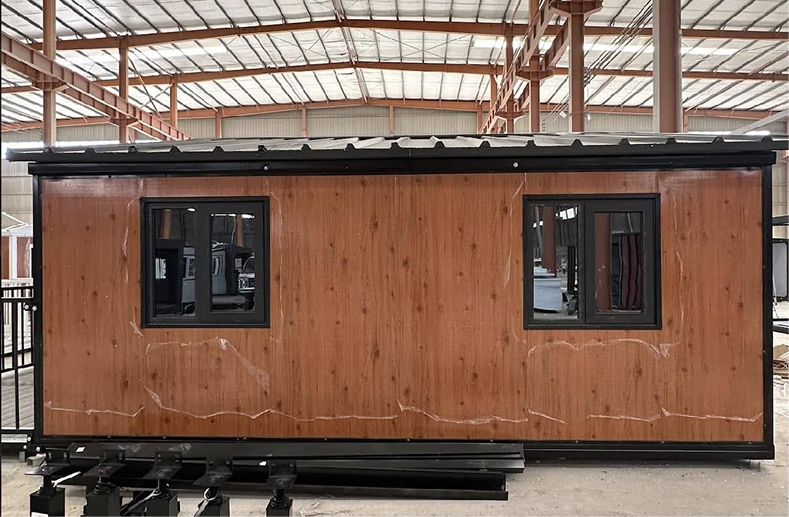 Pitched roof system for expandable container homes
