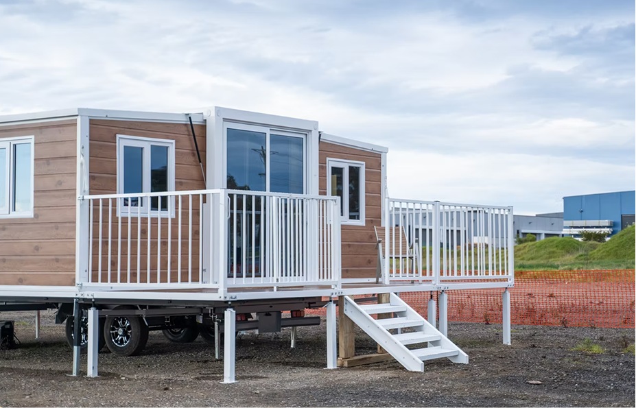 Expandable container home used as accommodation with deck and roof